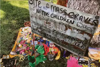  ?? Susan Montoya Bryan / Associated Press ?? A makeshift memorial for the dozens of Indigenous children who died more than a century ago while attending a nearby boarding school was created at a public park in Albuquerqu­e, N.M.