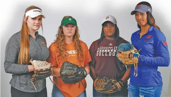  ?? STAFF PHOTO BY C.B. SCHMELTER ?? Area high school softball players Ashley Rogers, Kaili Phillips, Kayla Boseman and Cheyenne Lindsey, from left, all have signed to play for SEC teams — Meigs County’s Rogers and Silverdale Baptist Academy’s Phillips for Tennessee, Ooltewah’s Boseman...