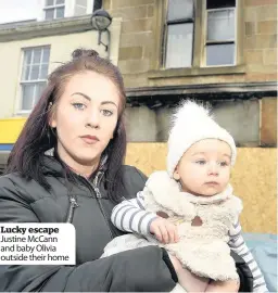  ??  ?? Lucky escape Justine McCann and baby Olivia outside their home