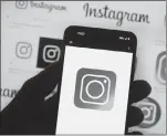  ?? ASSOCIATED PRESS PHOTO ?? The Instagram logo is seen on a cell phone in Boston. Instagram says it’s testing out new tools to protect young people and combat sexual extortion, including a feature that will automatica­lly blur nudity in direct messages.