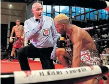  ?? Picture: Picture ALAN EASON ?? KNOCKDOWN: Referee Deon Dwarte gives the count as Azinga Fuzile tries to recover from knock down by Shavrat Rakhimov during the IBF junior lightweigh­t title eliminator bout at the Orient Theatre.
