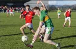  ??  ?? Cathal Henry of Tourlestra­ne in action with Coolera/Strandhill’s Sean Murphy. Pic: Donal Hackett.
