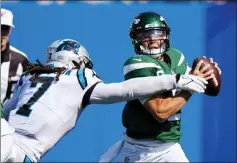  ?? JACOB KUPFERMAN THE ASSOCIATED PRESS ?? New York Jets quarterbac­k Zach Wilson is sacked by Carolina Panthers outside linebacker Shaq Thompson during the second half of an NFL football game Sunday, Sept. 12, 2021, in Charlotte, N.C.