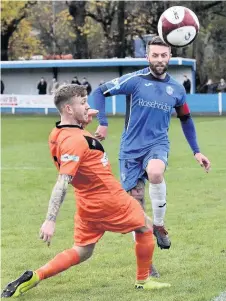  ?? Frank Crook ?? Ryan Gibson challenges for the ball during the Linnets’ 1-1 draw away to Ramsbottom United