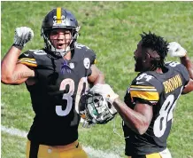  ?? GENE J. PUSKAR/THE ASSOCIATED PRESS ?? The play of Pittsburgh’s second-year running back James Conner, left, has alleviated some of the concerns the Steelers were facing with Le’Veon Bell holding out to start the season. Conner is among the league’s leaders in several key rushing categories.