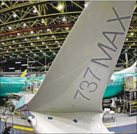  ?? Ted S. Warren Associated Press ?? BOEING announced this week that it will temporaril­y halt production of the 737 Max. The shutdown cast a cloud over firms that make the plane’s parts.