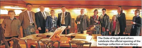  ??  ?? The Duke of Argyll and others celebrate the official opening of the heritage collection at Iona library.