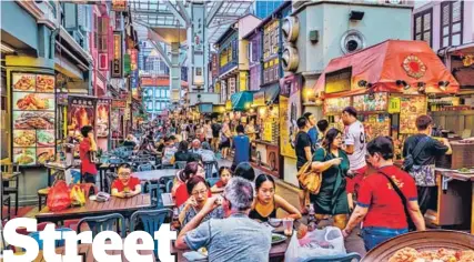  ?? SHUTTERSTO­CK ?? Singapore’s hawker stalls are a beloved part of city life. But even the regulated model has flaws. New chefs find it hard to survive, get subsidies, and innovate.