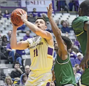  ?? Lori Van Buren / Albany Times Union ?? University at Albany's Cameron Healy had to overcome a root canal on Wednesday and the team will get another COVID test before it can play.