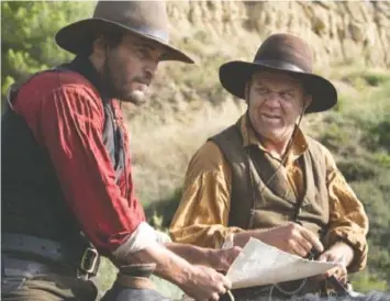  ?? MAGALI BRAGARD/ANNAPURNA PICTURES ?? Killers for hire Charlie Sisters (Joaquin Phoenix, left) and Eli Sisters (John C. Reilly) follow a strange trail into the black heart of the gold rush in “The Sisters Brothers.”