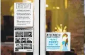  ?? RICH PEDRONCELL­I AP ?? Signs on the doors of a salon in Lodi remind customers of pandemic guidelines on Wednesday.