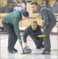  ?? JASON MALLOY/THE GUARDIAN ?? Skip Eddie MacKenzie throws a rock during the opening draw of the P.E.I. Tankard at the Cornwall Curling Club as teammates Chris Gallant, left, and Josh Barry get ready to sweep, if needed.