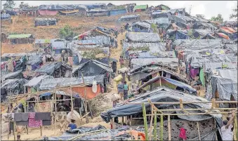  ?? [DAR YASIN/THE ASSOCIATED PRESS PHOTOS] ?? Newly set-up tents cover a hill at a refugee camp for Rohingya Muslims in Taiy Khali, Bangladesh.