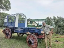  ?? /Lucille Davie ?? Rebuilding: Erik Holm with two of his restored wagons.