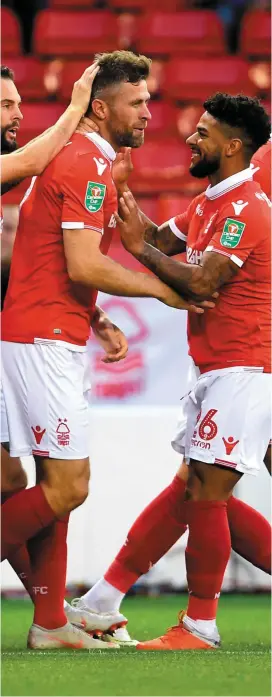  ?? JOE GIDDENS/PA ?? Ireland striker Daryl Murphy celebrates with his team-mates after scoring Nottingham Forest’s first goal during their shock Carabao Cup 3-1 victory over Newcastle United at the City Ground last night