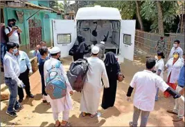  ??  ?? Attendees of a religious congregati­on in Delhi's Nizamuddin area board an ambulance for mandatory COVID-19 tests during a nationwide lockdown in the wake of the Coronaviru­s outbreak, in Agartala
