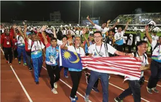  ??  ?? Dedicated to sports: Malaysian master athletes at the Asia Pacific Masters Gamesin Penang last month.