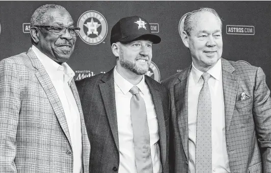  ?? Jon Shapley / Staff photograph­er ?? The first task for new Astros GM James Click, center, with new manager Dusty Baker and owner Jim Crane, is to repair the franchise’s tarnished image.