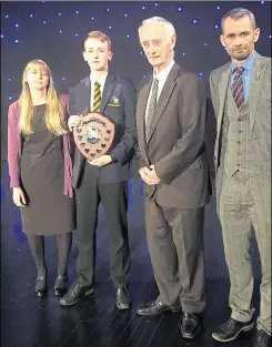  ??  ?? Rachael and David Kinghorn stand beside award recipient Jacob Kennedy and vice principal Rob Gaygan