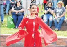 ?? KATHERINE HUNT/THE GUARDIAN ?? Bing Yao, of the Asian Cultural Artistic Group of P.E.I., performs during the fifth annual DiverseCit­y Multicultu­ral Street Festival in Montague on Sunday.
