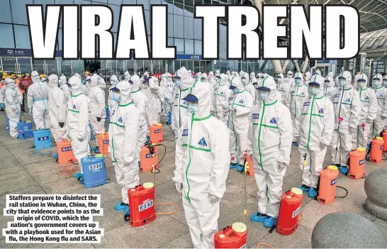  ?? AFP via Getty Images ?? Staffers prepare to disinfect the rail station in Wuhan, China, the city that evidence points to as the origin of COVID, which the nation’s government covers up with a playbook used for the Asian flu, the Hong Kong flu and SARS.