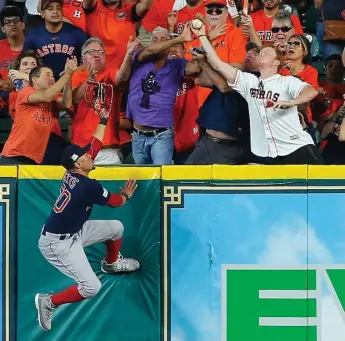  ?? BOB LEVEY/GETTY IMAGES ?? Boston outfielder Mookie Betts is unable to catch a home run by George Springer in the third inning of Game 2.