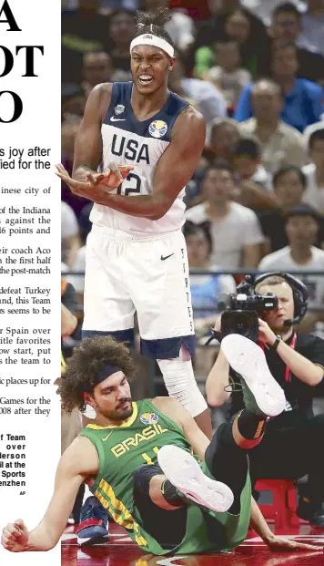  ??  ?? Myles Turner of Team USA stands over a fallen Anderson Varejao of Brazil at the Shenzhen Bay Sports Center in Shenzhen last Monday. AP