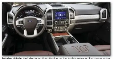  ??  ?? Interior details include decorative stitching on the leather-wrapped instrument panel topper, leather-wrapped armrests and an embroidere­d Super Duty logo on floor mats.