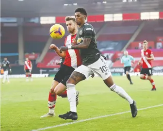  ??  ?? Manchester United's Marcus Rashford, in action with Southampto­n's Stuart Armstrong, has crafted his message on creating a better social safety net around right versus wrong, rather than a more political right versus left.