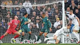  ?? ?? KNEE-SY DOES IT: Diego Llorente scores the winner for Leeds