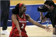  ?? MORRY GASH — THE ASSOCIATED PRESS ?? Arizona guard Aari McDonald (2) celebrates at the end of a women’s Final Four NCAA college basketball tournament semifinal game against Connecticu­t Friday, April 2, 2021, at the Alamodome in San Antonio. Arizona won 69-59.