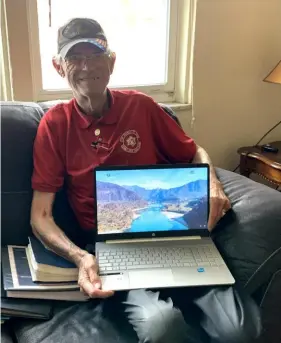  ?? Mary Pickels ?? Paul Svetahor, 81, of Greensburg, with the laptop computer he received from the Twilight Wish Foundation. He hopes to take college courses in cyber security and be hired for a job in that field.