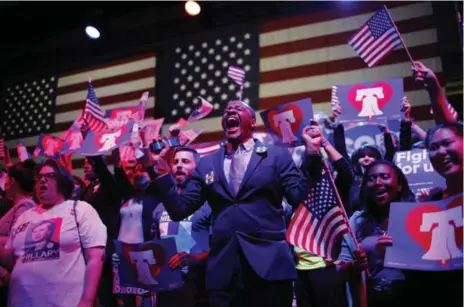  ?? EDUARODO MUNOZ ALVAREZ/AFP/GETTY IMAGES ?? Pennsylvan­ia supporters of Democratic presidenti­al candidate Hillary Clinton cheer shortly before her win in that state.