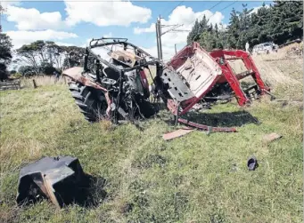  ?? Photo: WARWICK SMITH/FAIRFAX NZ ?? Serious accident: The wreck of the tractor that was hit by a train near Marton yesterday.
