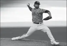  ?? K.C. ALFRED/THE SAN DIEGO UNION-TRIBUNE ?? Trevor Rosenthal of the San Diego Padres pitches against the Seattle Mariners at Petco Park on Sept.20, 2020 in San Diego.