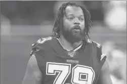  ?? DUANE BURLESON /AP ?? Cowboys defensive end Michael Bennett (79) stands during the national anthem before a game against the Lions on Nov. 17 in Detroit.