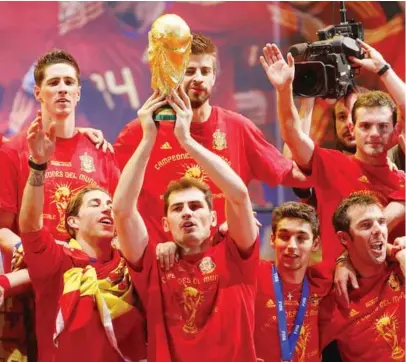  ??  ?? Iker Casillas of Spanish national football team holds the trophy during the Spanish team’s victory parade following their victory over the Netherland­s in the 2010 FIFA World Cup on July 12, 2010 in Madrid, Spain.