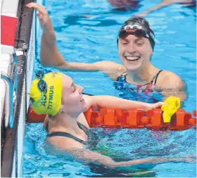  ??  ?? Ariarne Titmus and Katie Ledecky after the race.