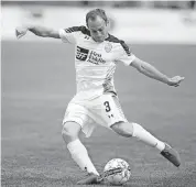  ?? [PHOTO BY NATE BILLINGS, ?? Oklahoma City’s Kyle Hyland passes the ball in last month’s USL game between Energy FC and the Tulsa Roughnecks FC at Taft Stadium. Energy FC hosts the Portland Timbers FC 2 on Saturday night.