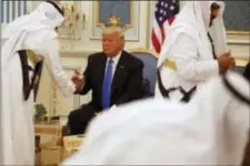  ?? EVAN VUCCI - THE ASSOCIATED PRESS ?? President Donald Trump is served coffee during a presentati­on ceremony of The Collar of Abdulaziz Al Saud Medal at the Royal Court Palace, Saturday, in Riyadh.