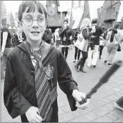  ?? Al Seib
Los Angeles Times ?? PACEY McWILLIAMS, 10, of Edmonton, Canada, holds a new magic wand at the Wizarding World of Harry Potter at Universal Studios Hollywood.