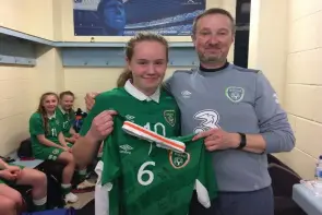  ??  ?? St Clare’s Comprehens­ive’s Muireann Devaney is pictured with Richard Berkeley, Rep of Ireland U15 manager after she was named Bob Docherty Cup Player of the Tournament.