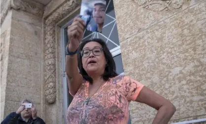  ?? Photograph: Canadian Press/Rex/Shuttersto­ck ?? Debbie Baptiste, the mother of Colten Boushie, holds up a picture of her son on the steps of the courthouse during the trial of Gerald Stanley on 5 February 2018.