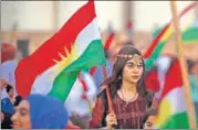  ?? AFP ?? Syrian Kurds wave Kurdish flag backing independen­ce.