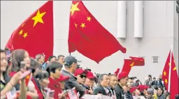  ?? ?? Red scare: Xi supporters line his motorcade route Tuesday in San Francisco.