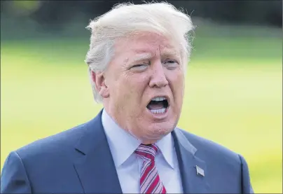  ?? AP PHOTO ?? In this Sept. 29 file photo, President Donald Trump talks to media as he walks across the south lawn of the White House in Washington. Trump is lashing out at the mayor of Puerto Rico’s capital city in a war of words over recovery efforts after...