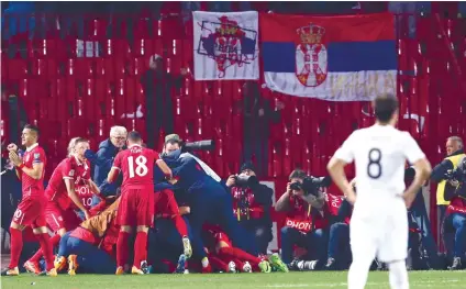  ??  ?? CELEBRATE. Serbia’s Aleksandar Prijovic celebrates with his teammates after scoring a goal, during the World Cup Group D qualifying soccer match between Serbia and Georgia in Belgrade. AP FOTO