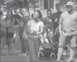  ?? PHOTOS BY MELANIE STENGEL/SPECIAL TO THE COURANT ?? Lakie Shevin Lightner-Padgett, of East Hartford, listens to speakers at the Women’s Equality Day rally in Hartford.