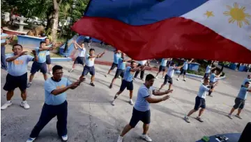  ?? MARIANNE BERMUDEZ ?? FOR FLAB AND COUNTRY To serve and protect—and Zumba in between—seems to be the new motto of the Manila Police District which has directed its members to hit the dance floor as part of their regular fitness regimen.