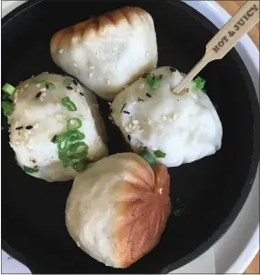  ?? MARY ORLIN — BAY AREA NEWS GROUP ?? Sheng jian bao, or SJB, pork dumplings are one of the signature dishes on the Market Restaurant menu at China Live in San Francisco’s Chinatown.